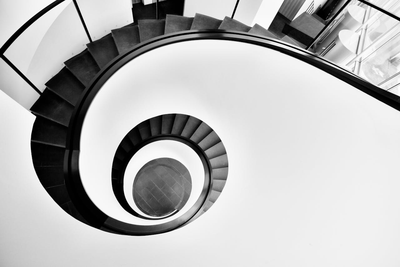 Artistic black and white photo of a spiral staircase in Nürnberg, Germany.